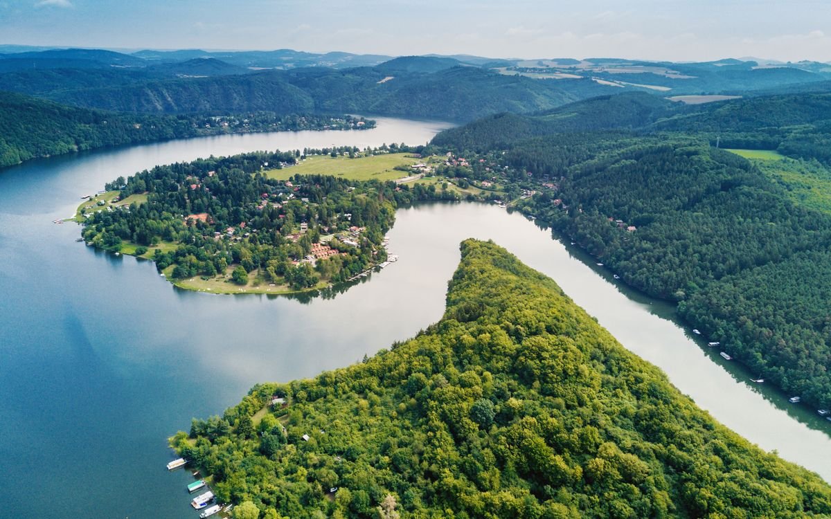Aerial view of a river among forested land